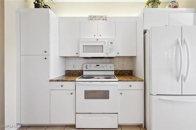 kitchen featuring white cabinetry, white appliances, light tile patterned floors, and tasteful backsplash