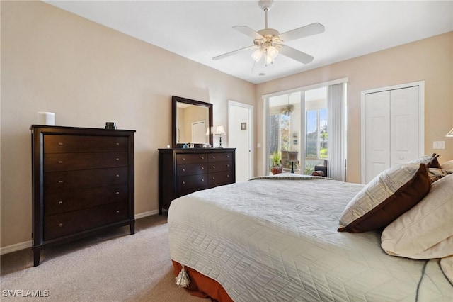 carpeted bedroom featuring a closet, baseboards, and ceiling fan