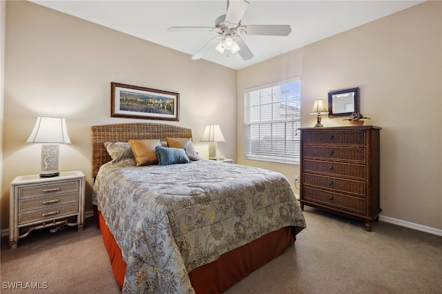 carpeted bedroom with baseboards and a ceiling fan