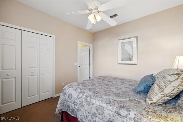 carpeted bedroom featuring visible vents, a closet, and a ceiling fan