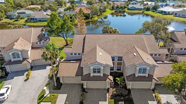 aerial view with a residential view and a water view