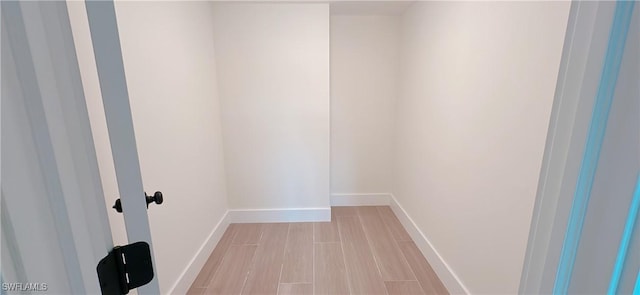 interior space featuring light wood-style floors and baseboards