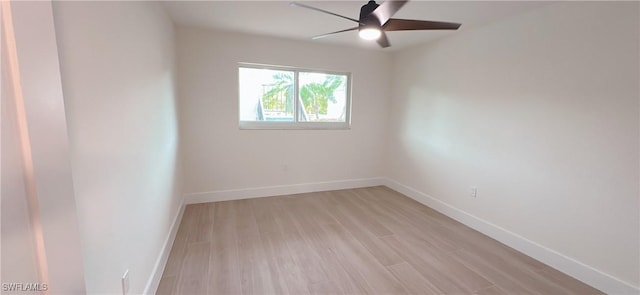 empty room featuring ceiling fan, baseboards, and light wood-style flooring