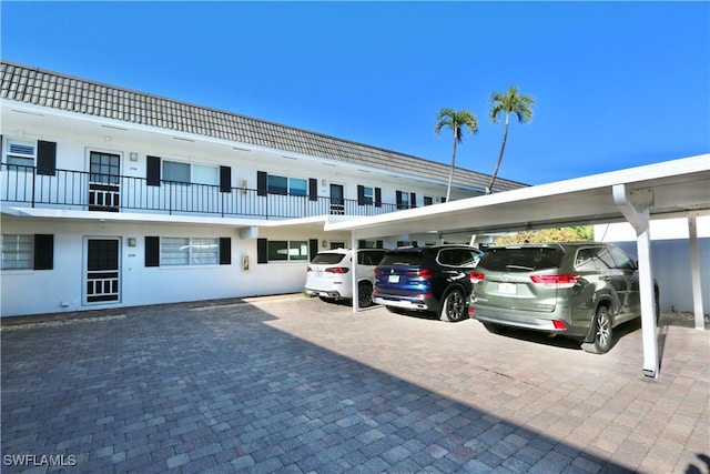 view of partially covered parking lot