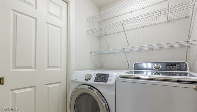 laundry area featuring washer and dryer and laundry area