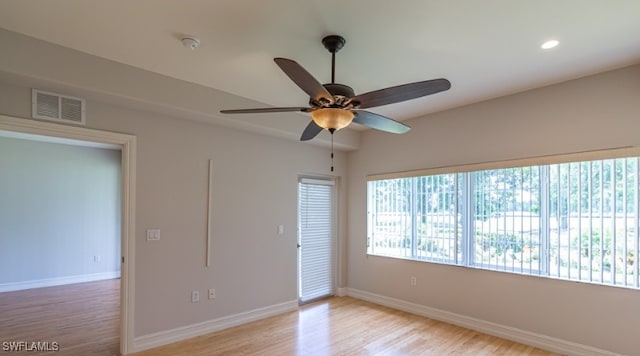 unfurnished room featuring a ceiling fan, baseboards, visible vents, light wood-style flooring, and recessed lighting