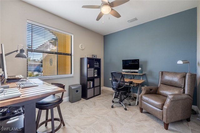 office space featuring visible vents, baseboards, and a ceiling fan