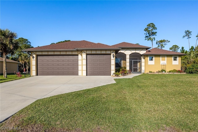 view of front facade with stucco siding, a front lawn, concrete driveway, and a garage