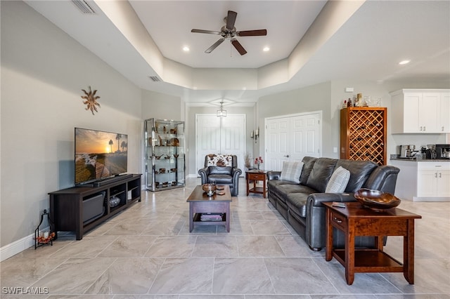 living room with recessed lighting, visible vents, baseboards, and a ceiling fan