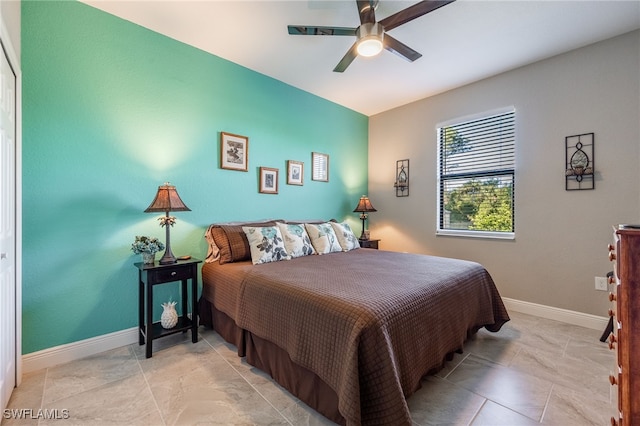 bedroom featuring a ceiling fan and baseboards