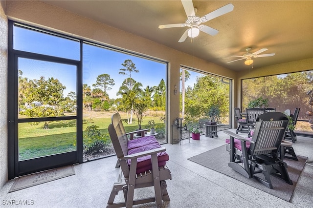 sunroom / solarium with ceiling fan