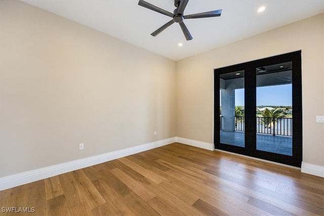 unfurnished room featuring recessed lighting, baseboards, wood finished floors, and a ceiling fan