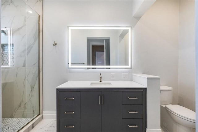 bathroom featuring a marble finish shower, toilet, marble finish floor, and vanity