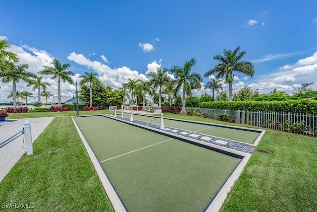 surrounding community featuring a lawn and fence