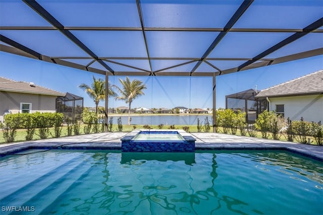 view of pool featuring a lanai, a water view, and a pool with connected hot tub