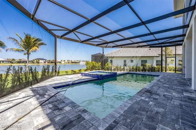 view of pool featuring glass enclosure, a patio area, a water view, and a pool with connected hot tub