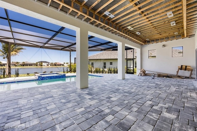 view of patio / terrace with a water view, a lanai, and a pool with connected hot tub