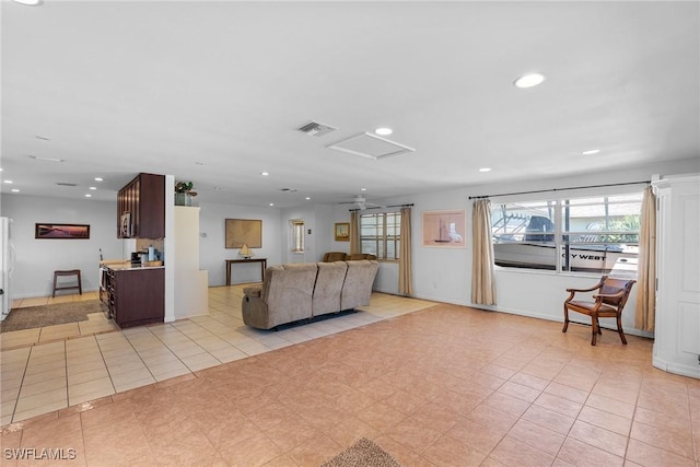 2032 Bahama Ave, Fort Myers, FL 33905 - living room with visible vents, recessed lighting, light tile patterned floors, and attic access