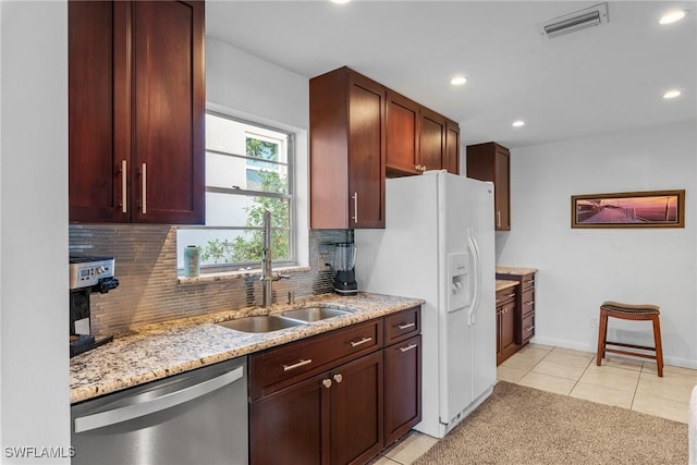 2032 Bahama Ave, Fort Myers, FL 33905 - kitchen with a sink, tasteful backsplash, light stone countertops, stainless steel dishwasher, and visible vents