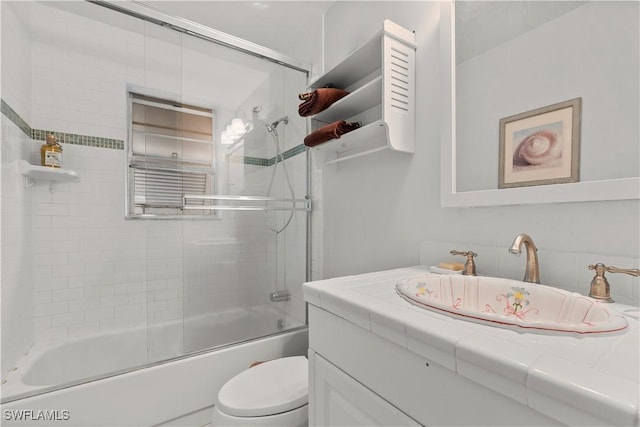 2032 Bahama Ave, Fort Myers, FL 33905 - bathroom with toilet, vanity, and enclosed tub / shower combo
