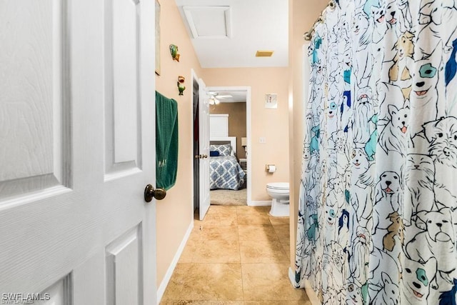 ensuite bathroom with a shower with curtain, baseboards, tile patterned floors, toilet, and connected bathroom