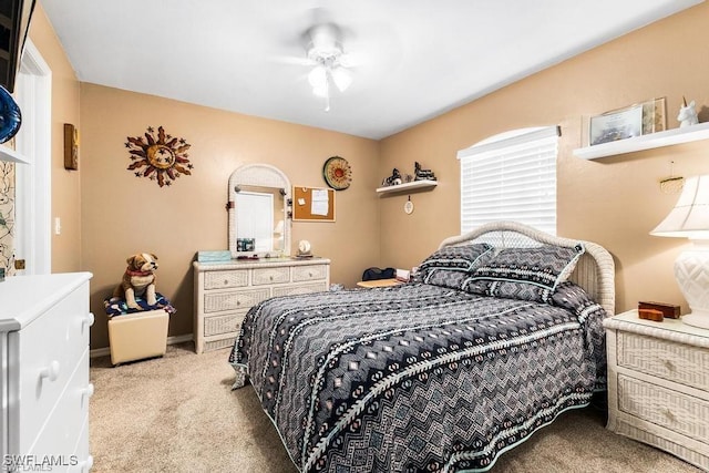 bedroom with ceiling fan and carpet flooring