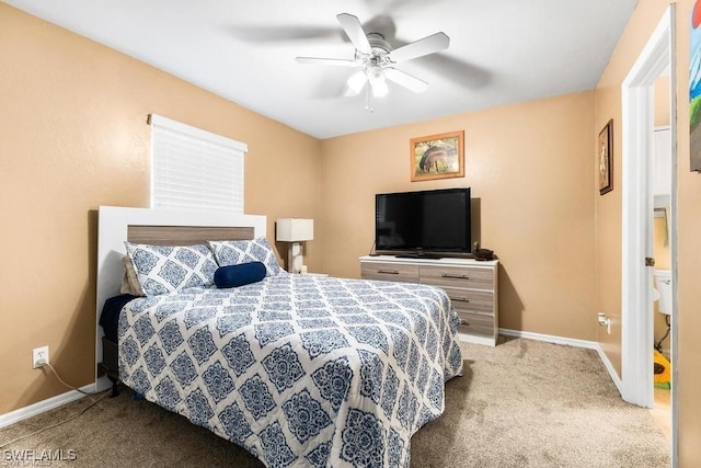 bedroom with a ceiling fan, baseboards, and carpet floors