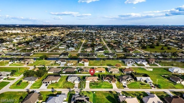 bird's eye view featuring a residential view and a water view