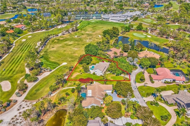 aerial view featuring a residential view, a water view, and golf course view