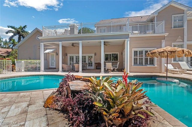 pool with a patio area, french doors, a ceiling fan, and fence