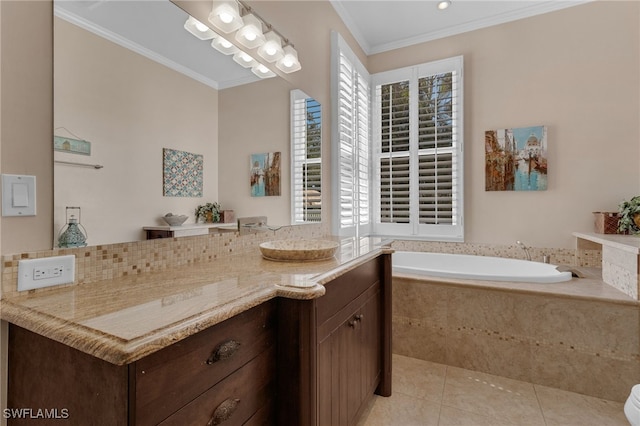 bathroom featuring tile patterned flooring, a bath, crown molding, and a sink