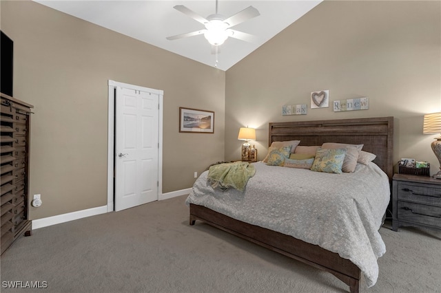 carpeted bedroom featuring baseboards, lofted ceiling, and ceiling fan