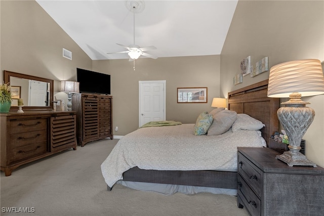 bedroom with visible vents, baseboards, light colored carpet, high vaulted ceiling, and a ceiling fan