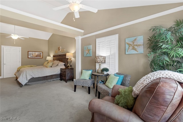 carpeted bedroom with ceiling fan, crown molding, and vaulted ceiling