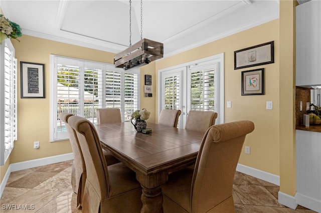 dining room with french doors, baseboards, and ornamental molding