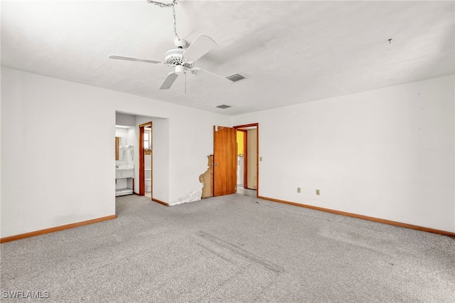 unfurnished room with a ceiling fan, carpet flooring, baseboards, and visible vents