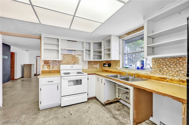 kitchen with open shelves, white range with electric cooktop, light countertops, decorative backsplash, and a sink