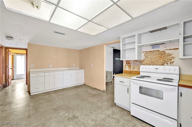 kitchen featuring visible vents, white cabinetry, concrete flooring, and white electric range oven