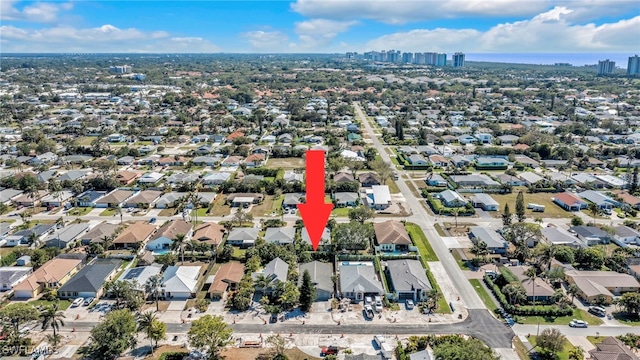 birds eye view of property with a residential view