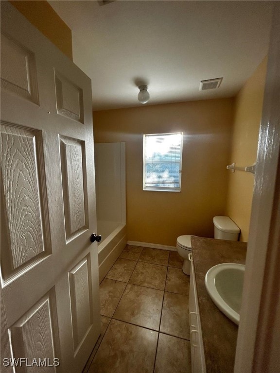 1926 NE 15th Ln, Cape Coral, FL 33909 - bathroom with vanity, visible vents, baseboards, tile patterned flooring, and toilet