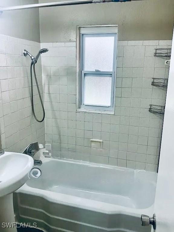 bathroom featuring washtub / shower combination