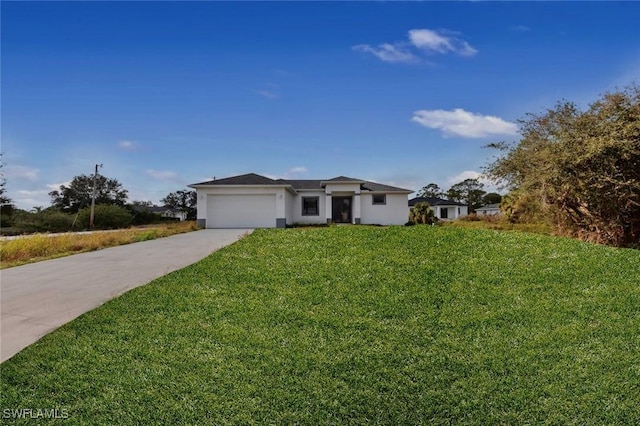 view of front of home with concrete driveway, a garage, and a front yard