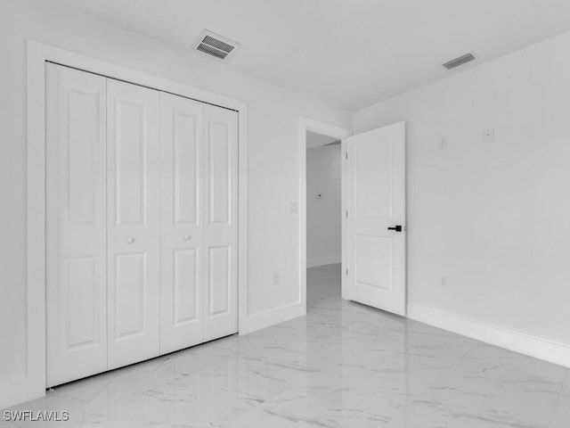 unfurnished bedroom with baseboards, visible vents, and marble finish floor