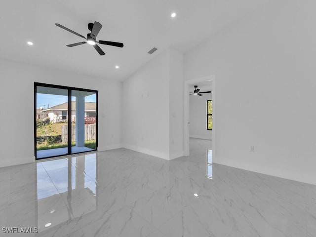 empty room featuring recessed lighting, visible vents, marble finish floor, and a wealth of natural light