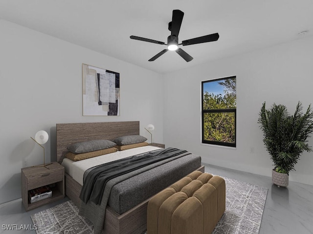 bedroom with baseboards, marble finish floor, and ceiling fan