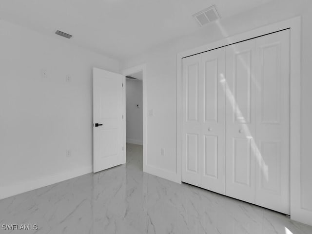 unfurnished bedroom with visible vents, baseboards, and marble finish floor