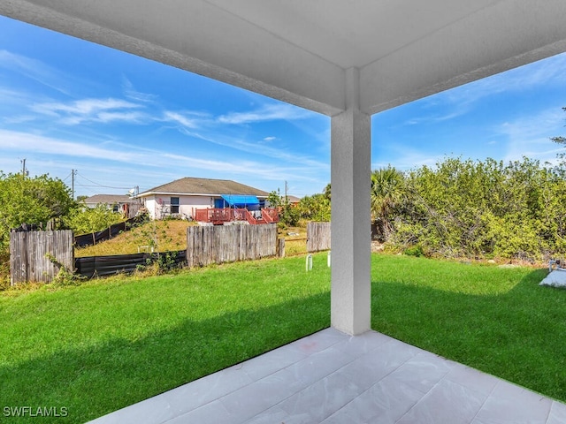 view of yard featuring a patio and fence