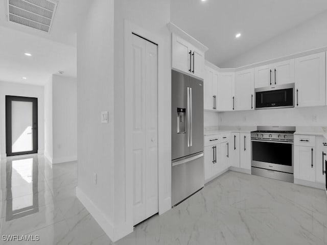 kitchen featuring visible vents, light countertops, white cabinets, appliances with stainless steel finishes, and marble finish floor