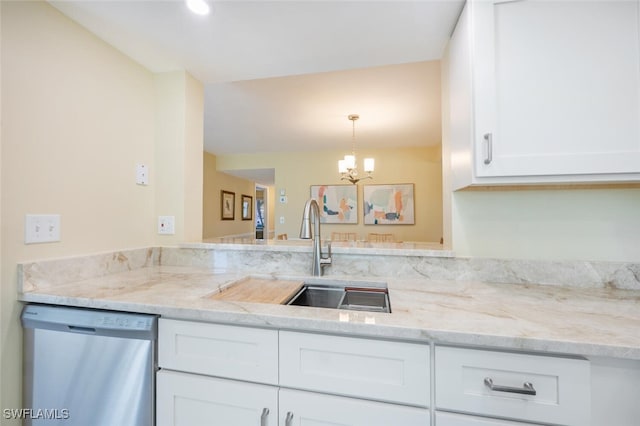 kitchen featuring dishwasher, light stone counters, a notable chandelier, white cabinetry, and a sink