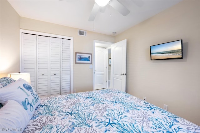 bedroom with visible vents, a closet, and a ceiling fan